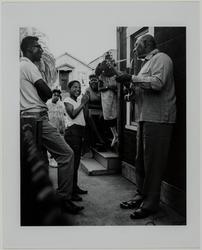 Man Playing Guitar with Large Group Listening (West Oakland)