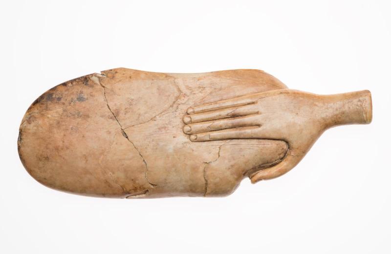 Spoon in the form of a hand holding a shell