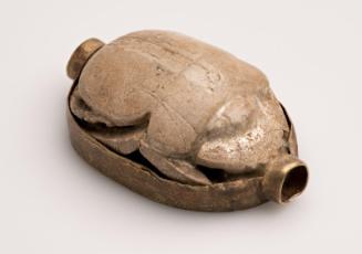 Scarab in a old mount with an interlocking spiral and hieroglyphic base design