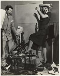 Actress Gertrude Lawrence and sound effects man on stage at Gertrude Lawrence's radio show., 1944