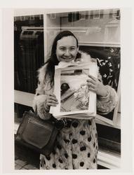 (Elsa holding photograph of Allen)
