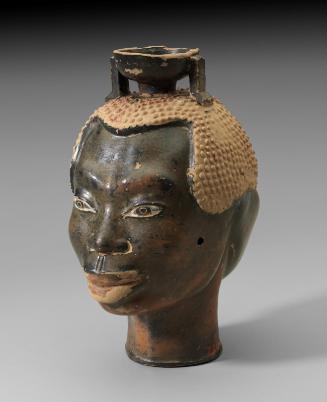 Perfume flask (aryballos) in the shape of two male heads