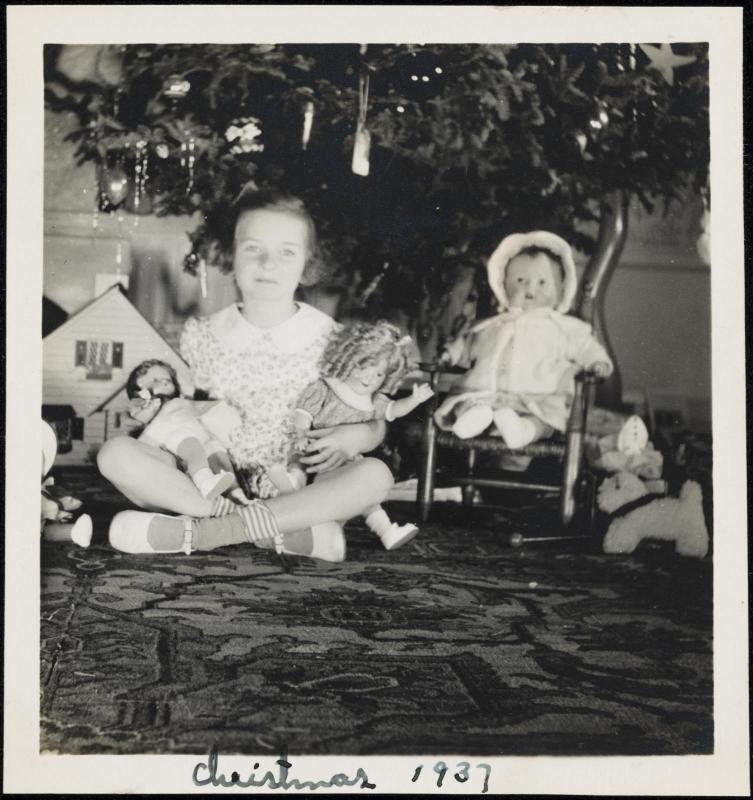 Girl with dolls (including Shirley Temple) on Christmas