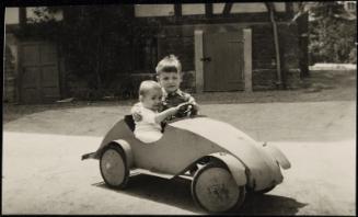 Two boys in toy car
