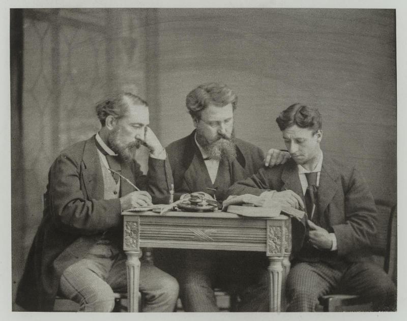 Untitled (three men around a table)