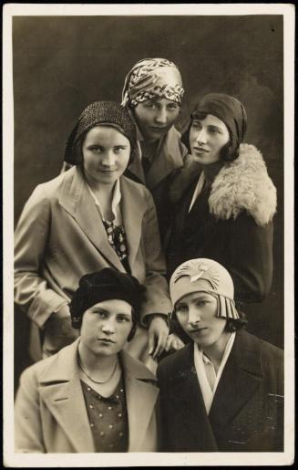 Five young women in hats grouped together