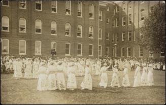 Large group of women on school lawn