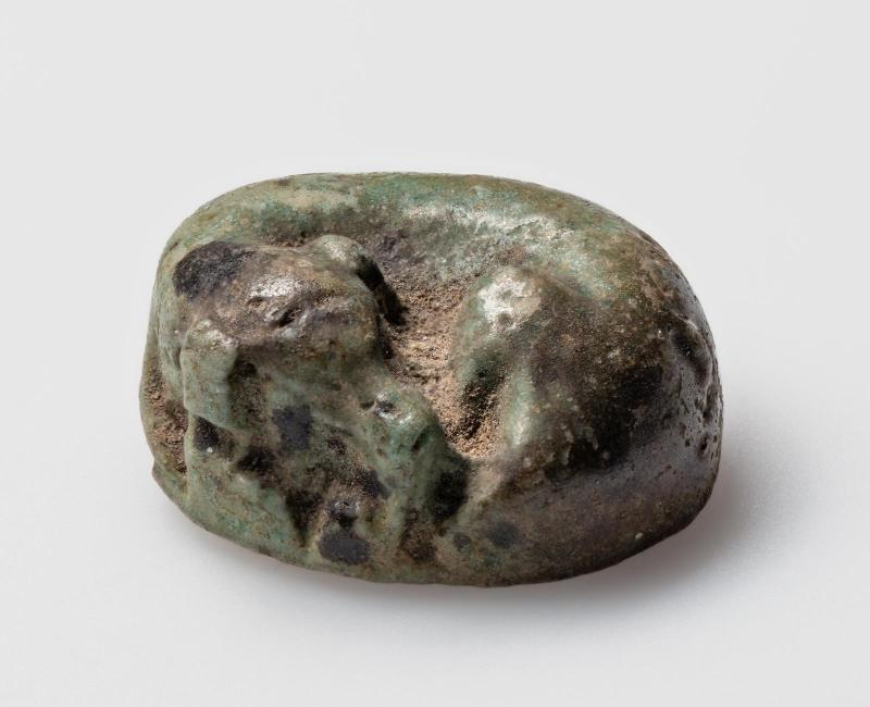 Recumbent dog playing piece