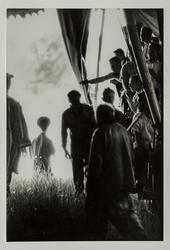 The Dwarf (standing by entrance to circus tent)