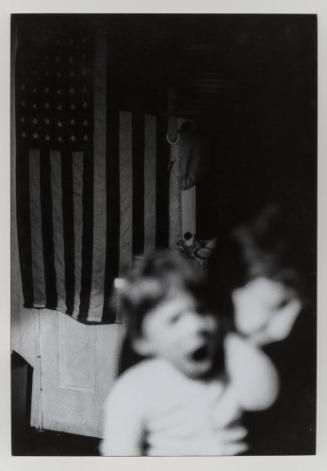 Untitled (boy with flag in background)