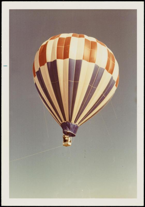 Red, white and blue hot air balloon in sky