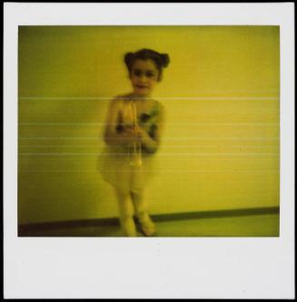 Little girl with pigtails and dance costume (?)