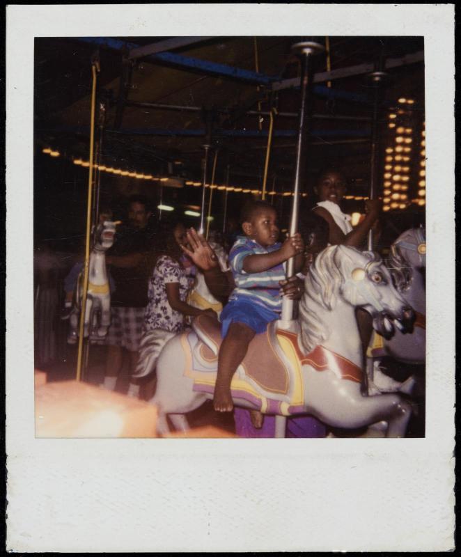 African American children on carousel horses
