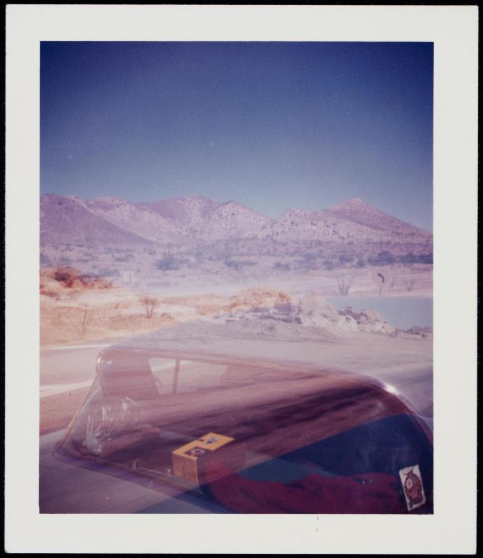 Automobile and mountainous landscape
