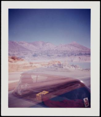 Automobile and mountainous landscape