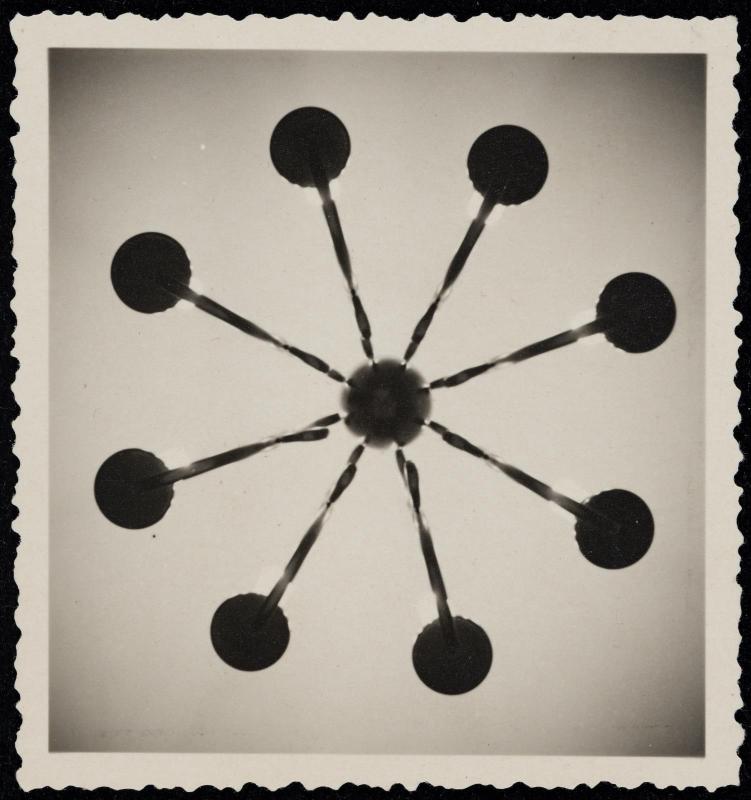 Abstract form with spokes and circles emanating from center