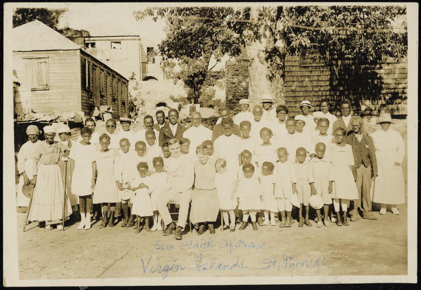 Sam and Edith Elfstrom seated amongst large group of people, Virgin Islands, Saint Thomas