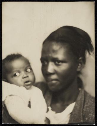 Photo booth portrait of young woman and infant