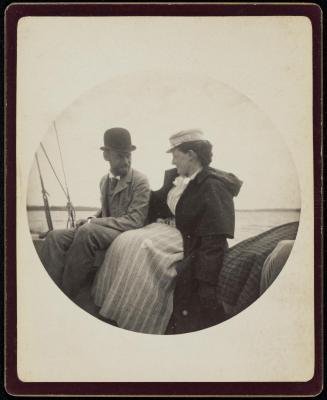 Circular Kodak portrait of man and woman seated on a boat