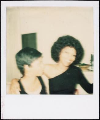 Blurred image of two figures embracing