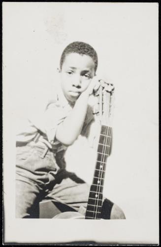 Young boy with guitar