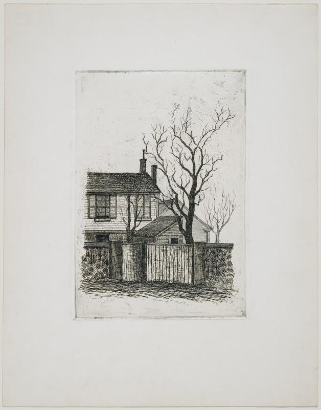 Portion of house, with wall and bare tree