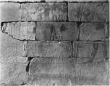Lower long wall to left of stela