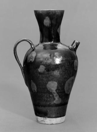 Ewer with dark brown glaze and russet dots