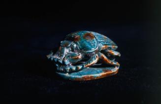 Scarab with an openwork profile