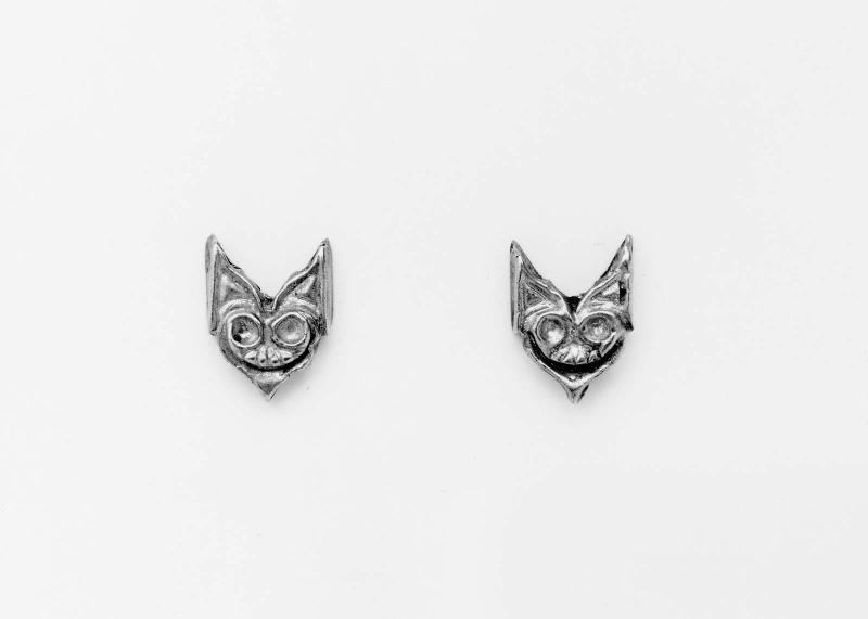 Two ivy-shaped ornaments