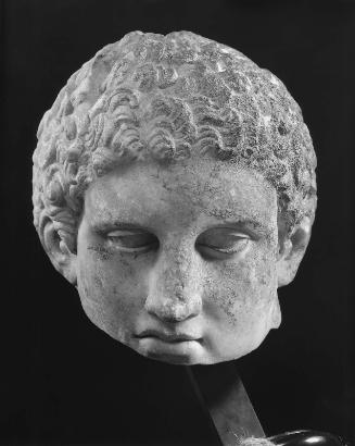 Head of an athlete pouring oil into his hand