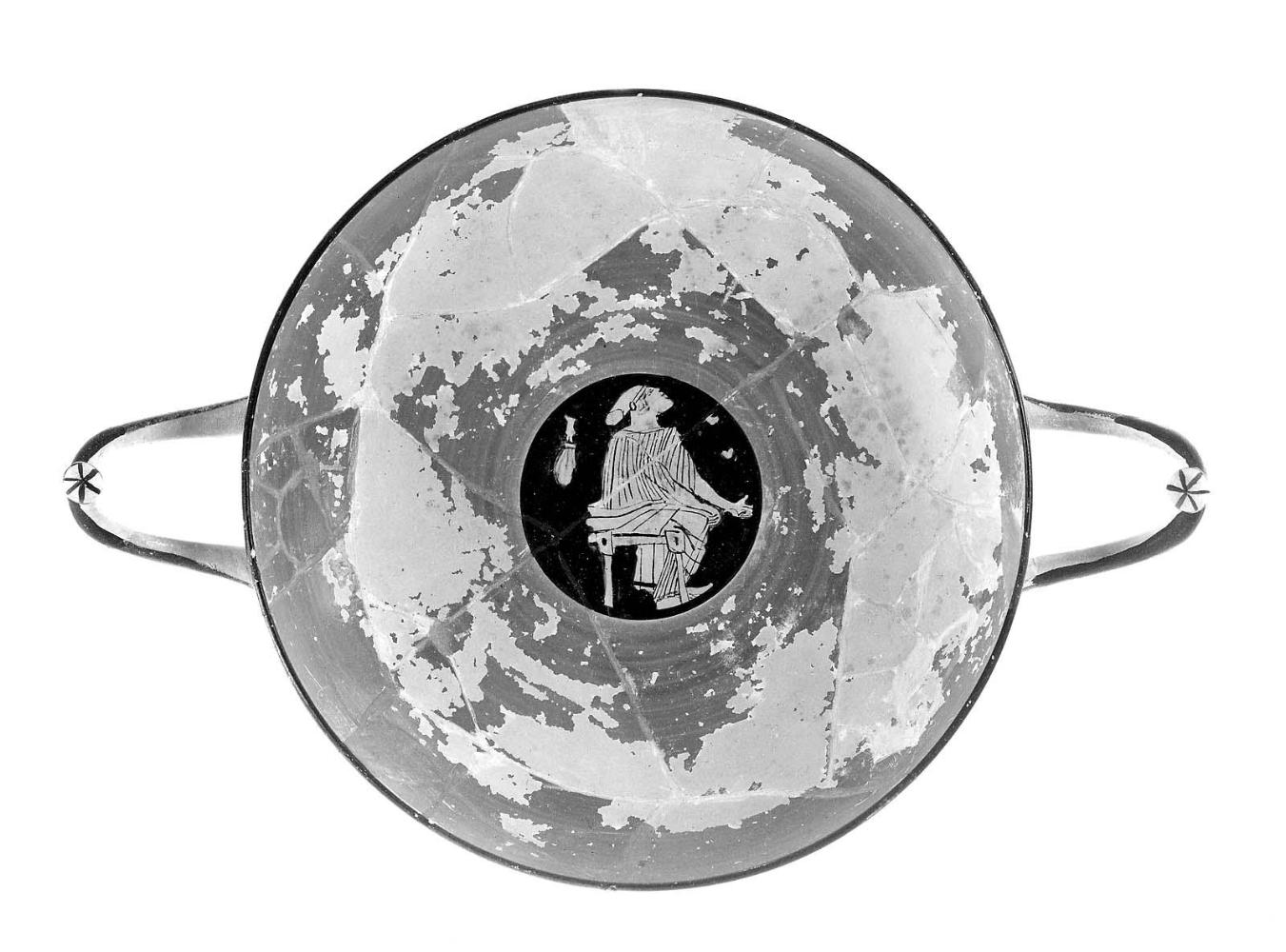 Drinking cup (kylix) depicting a seated woman