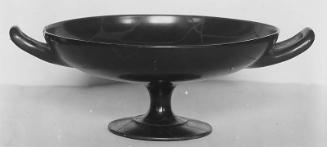 Drinking cup (kylix) with satyr seated on a storage jar (amphora)