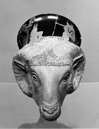 Ram's head rhyton with a seated youth receiving shield and spear from a woman