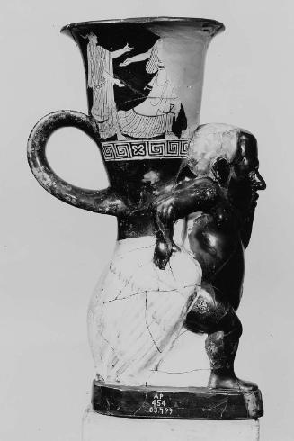 Athenian red figure cup supported by a pygmy dragging a crane