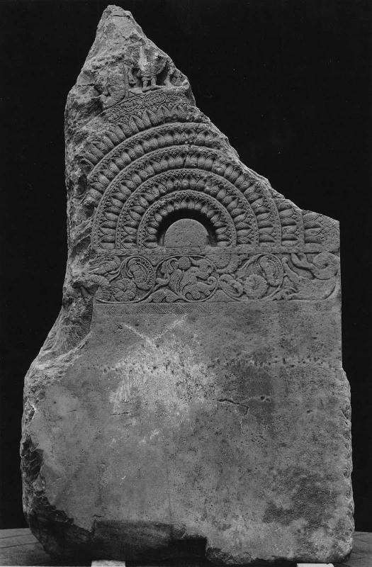 Fragment of a relief: Half wheel with floral motifs