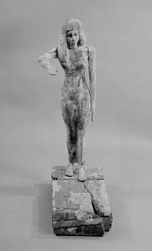 Statue of girl in unusual attitude with hieroglyphic text on base