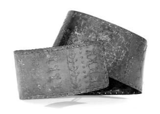 Belt with repousée design