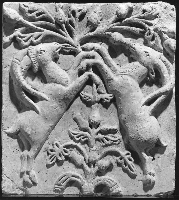 Panel: two goats browsing in a tree
