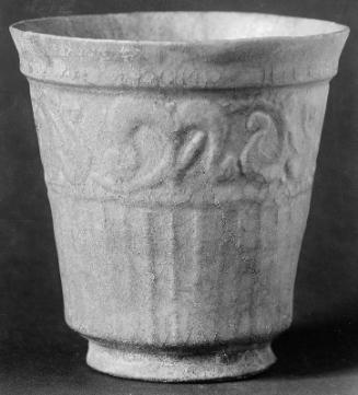 Beaker with carved design