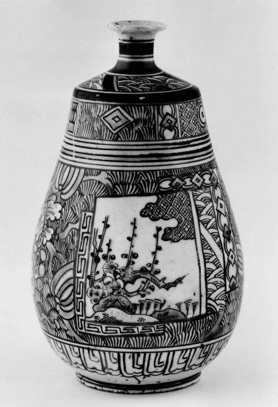 Bottle with decoration of panels with plum