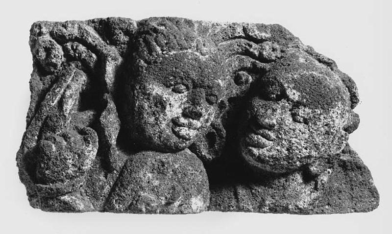 Architectural fragment with a relief of two heads