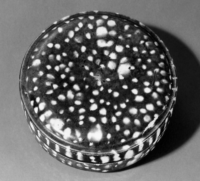 Circular box with dotted design