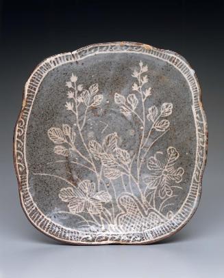 Dish with design of flowers and grasses