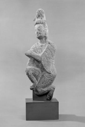 Kneeling figure