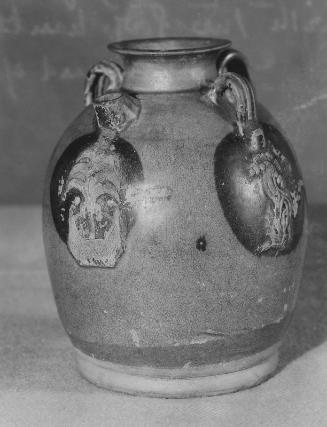 Ewer with applique decoration of lion and palm tree