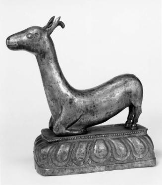 Male Deer Kneeling on Forelegs