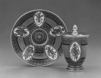 Covered beaker and saucer