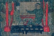 Background - Wenji and her husband seated in tent