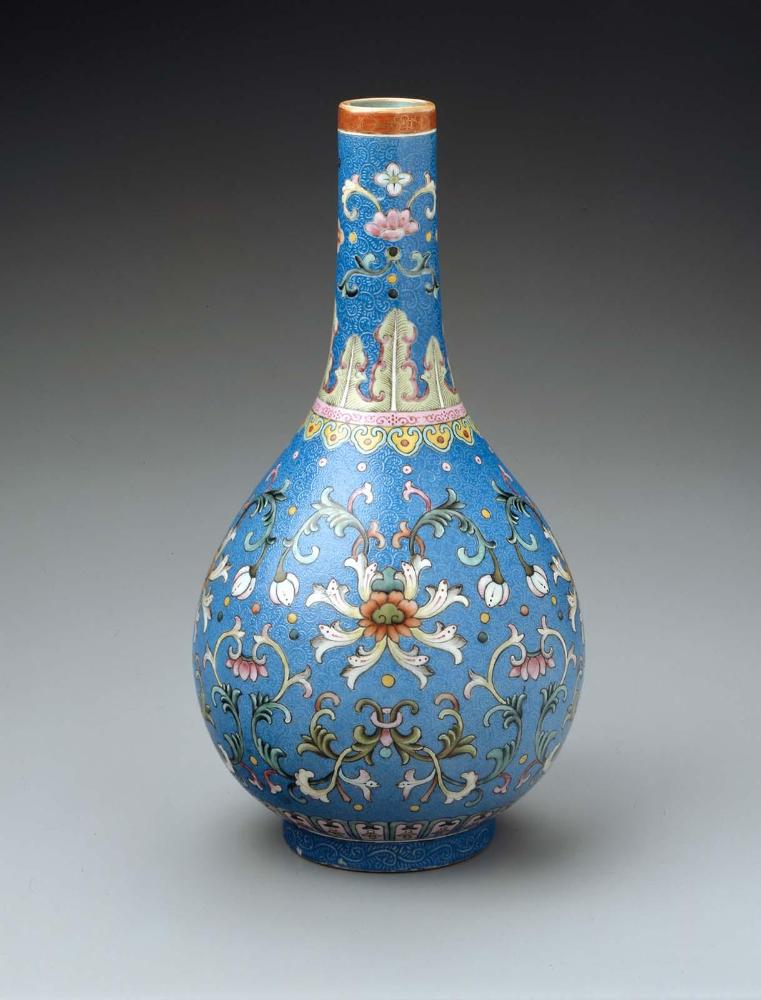 Long-necked ovoid vase with floral scroll over blue ground